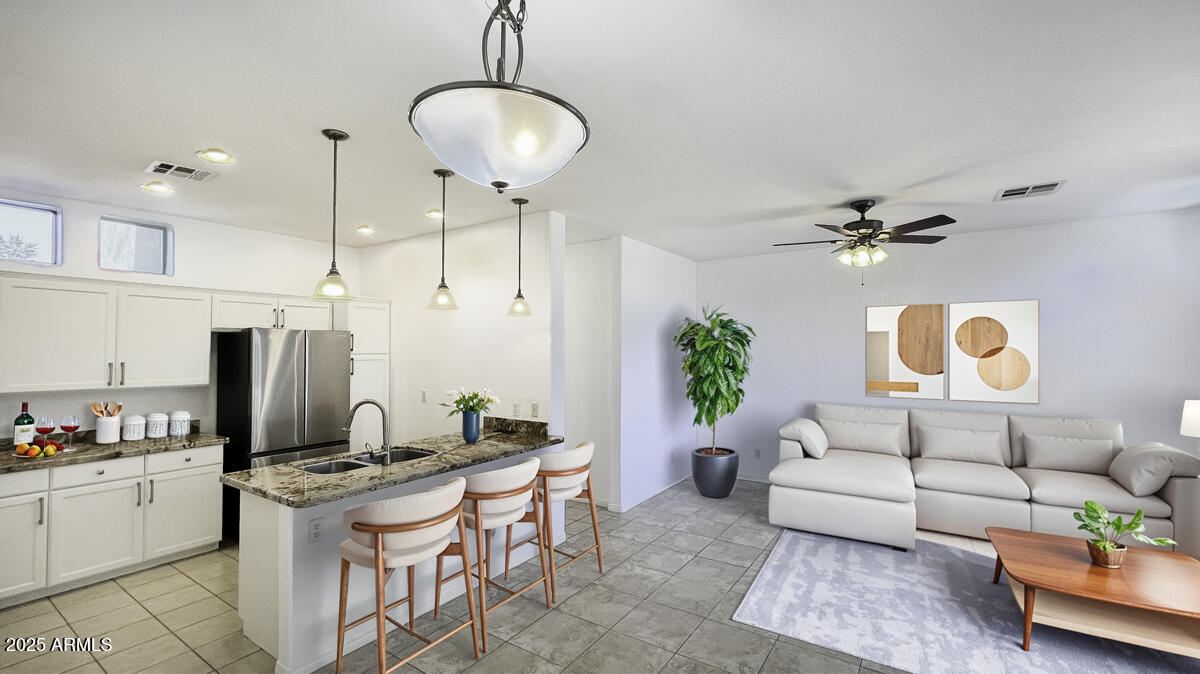 123 North Washington Street, Unit 22 Chandler, AZ 85225 - Photo 2 of 33 a living room with stainless steel appliances kitchen island granite countertop furniture and a view of kitchen