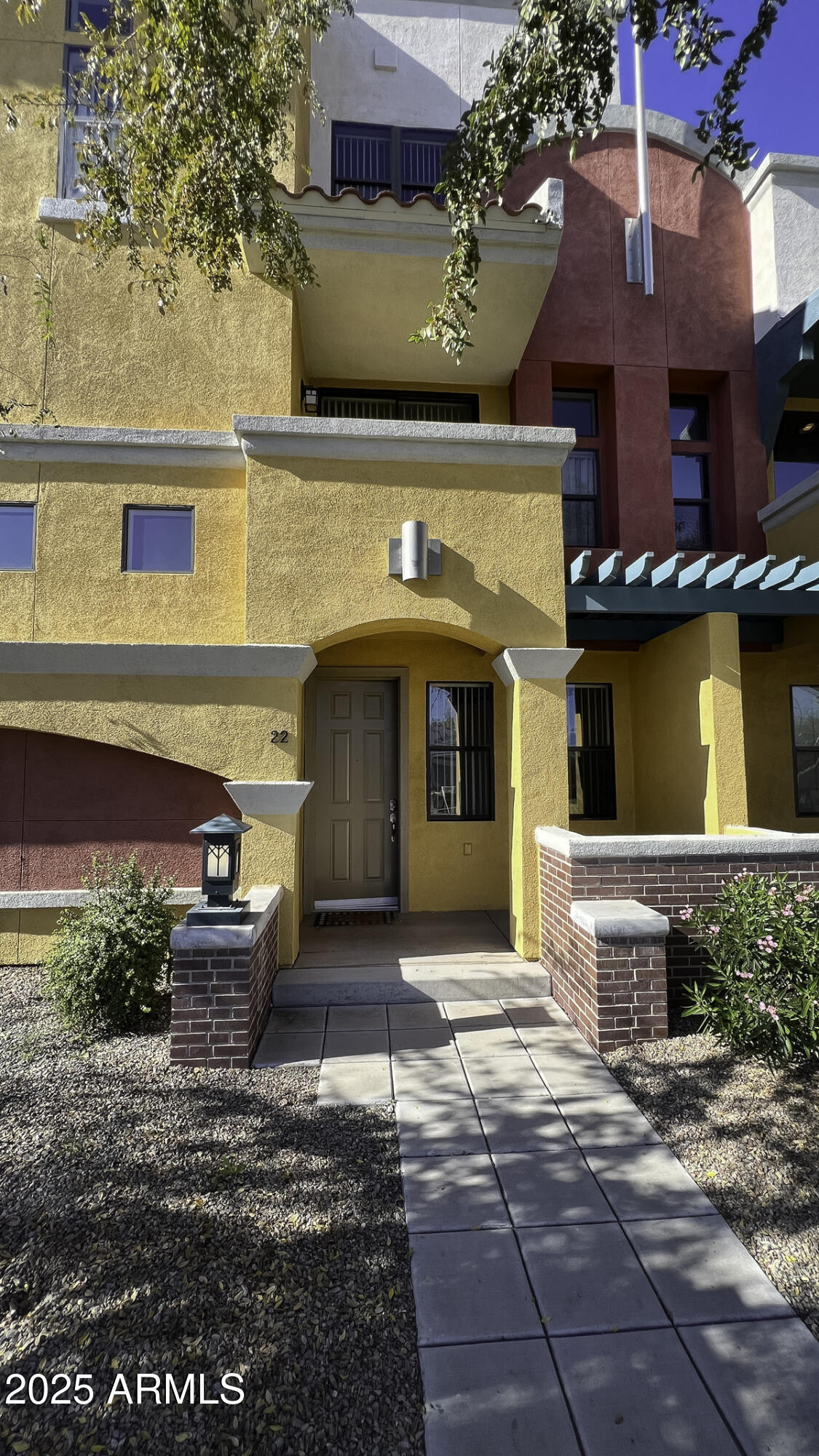 123 North Washington Street, Unit 22 Chandler, AZ 85225 - Photo 28 of 33 a front view of a house with plants