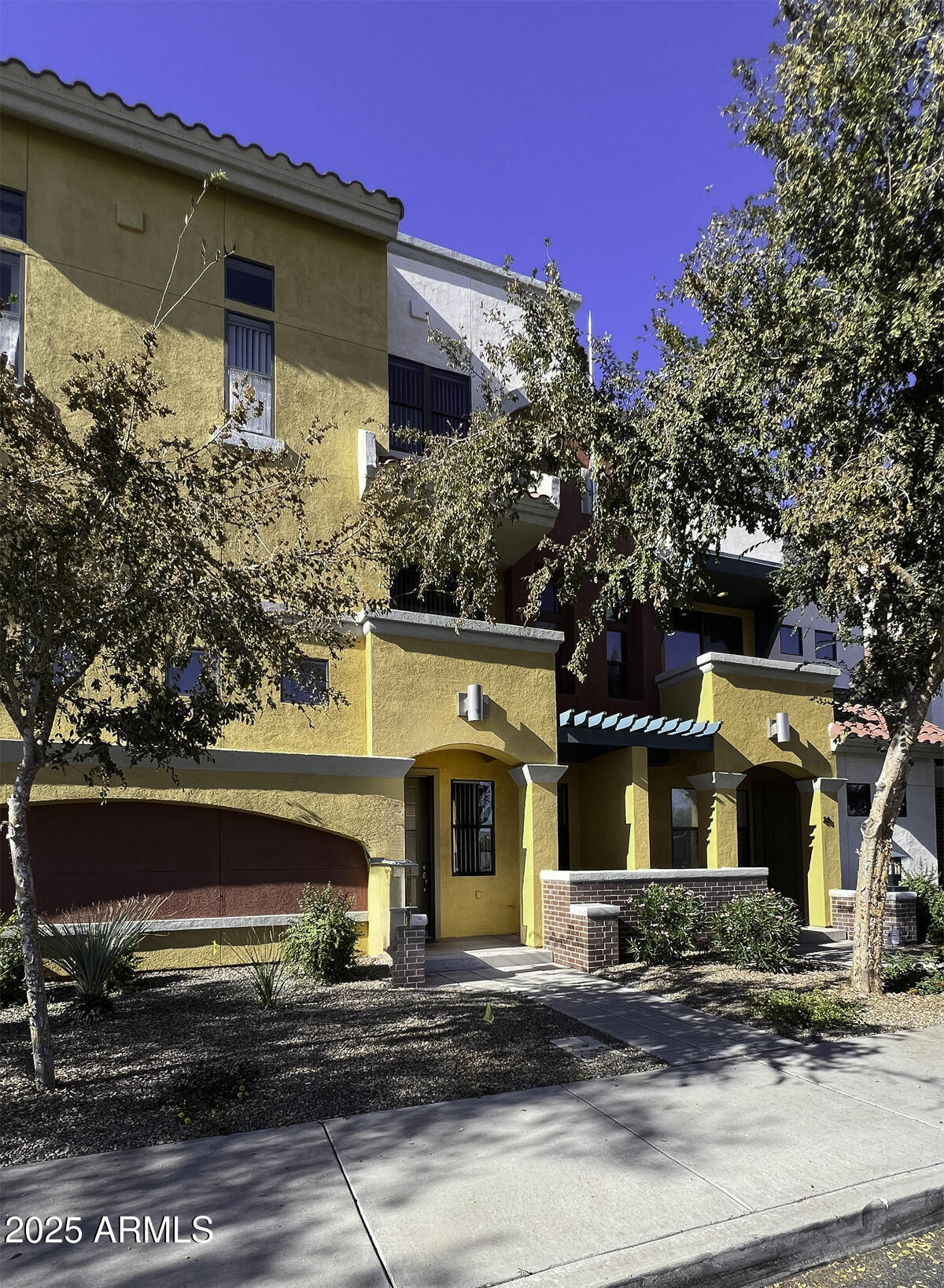 123 North Washington Street, Unit 22 Chandler, AZ 85225 - Photo 29 of 33 a front view of a house with a yard