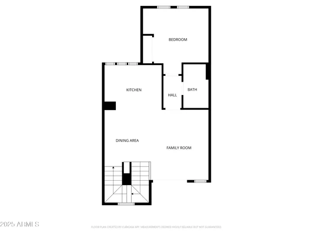 a front view of a house with plants