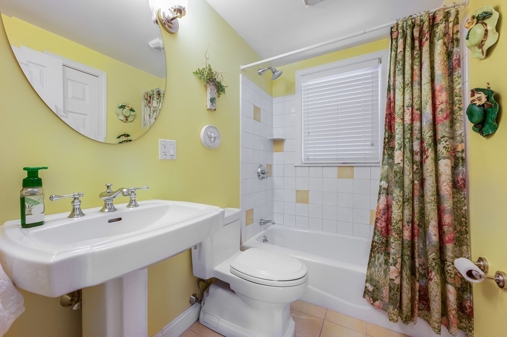 14 Mitchell Road Lynnfield, MA 01940 - Photo 15 of 36 a bathroom with a sink toilet and shower