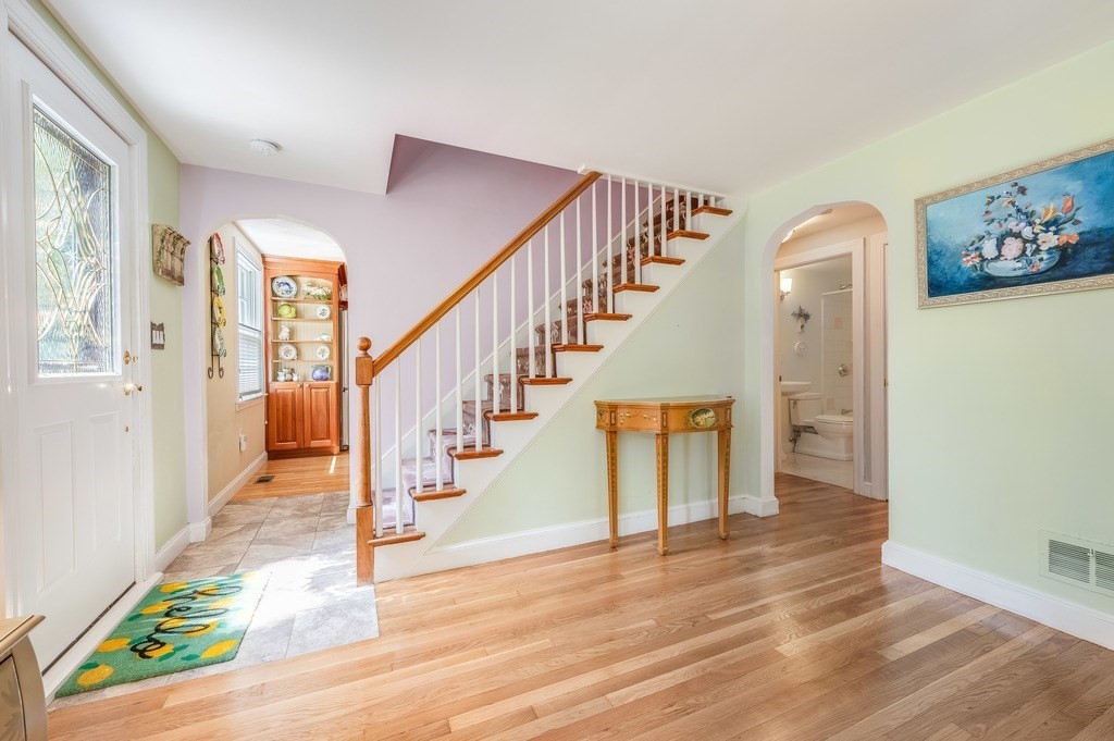 14 Mitchell Road Lynnfield, MA 01940 - Photo 20 of 36 a view of entryway and hall with wooden floor