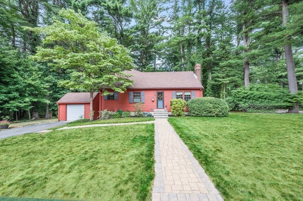 14 Mitchell Road Lynnfield, MA 01940 - Photo 2 of 36 a front view of a house with a yard and trees