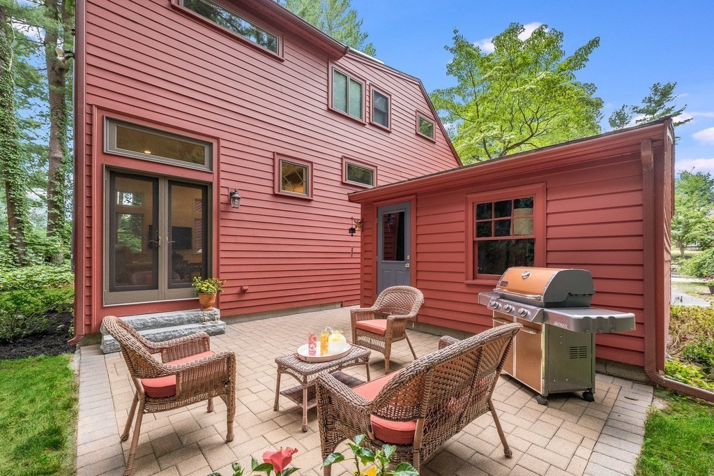 14 Mitchell Road Lynnfield, MA 01940 - Photo 31 of 36 a backyard of a house with table and chairs