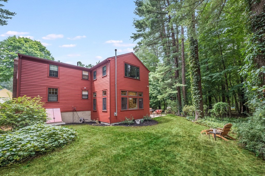 14 Mitchell Road Lynnfield, MA 01940 - Photo 36 of 36 a view of a backyard with potted plants and large tree
