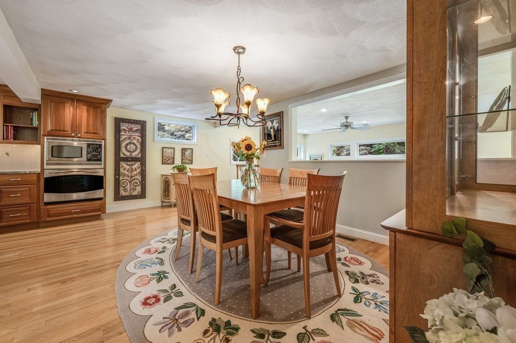 14 Mitchell Road Lynnfield, MA 01940 - Photo 8 of 36 a view of a dining room with furniture wooden floor and chandelier