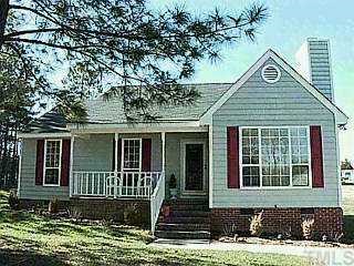 204 Round About Road Holly Springs, NC 27540 - Photo 1 of 1 a front view of a house with yard