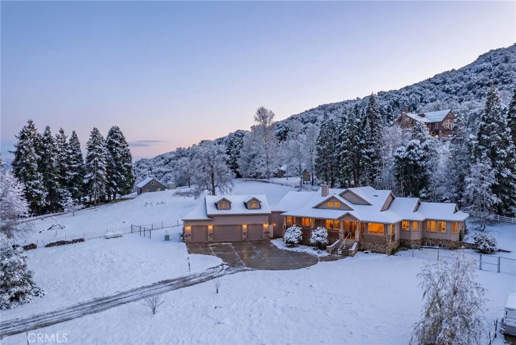 11821 Raspberry Lane Oak Glen, CA 92399 - Photo 49 of 49 Snow is AI generated. This property does receive snowfall. It was not snowing the day of this photo.