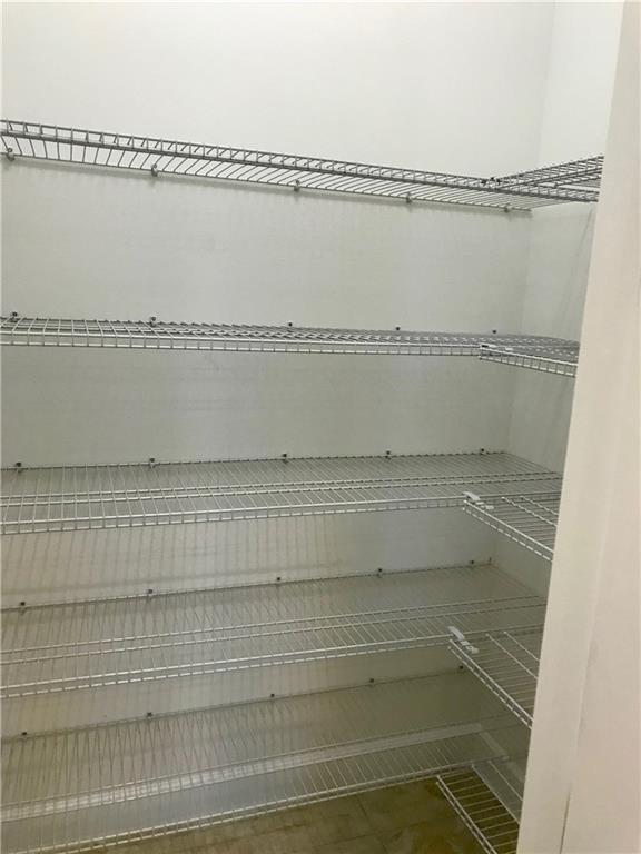 5208 Beland Drive Lake Worth, FL 33467 - Photo 15 of 21 a view of a walk in closet and a bathroom