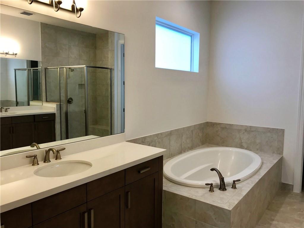 5208 Beland Drive Lake Worth, FL 33467 - Photo 9 of 21 a bathroom with a sink and a bathtub