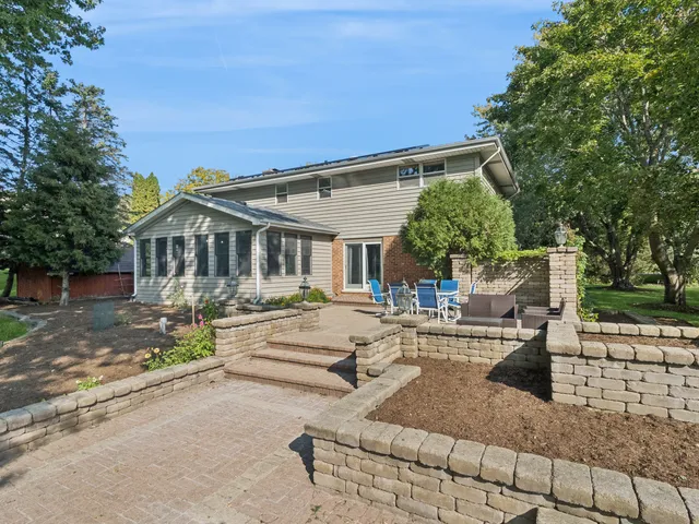 a view of house with outdoor seating and city view