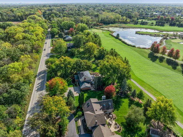 an aerial view of a houses with outdoor space and lake view