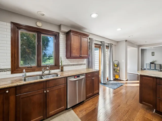 a large kitchen with lots of counter space and a sink