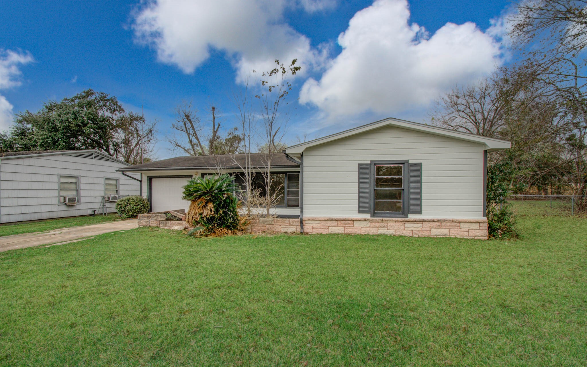 2417 Pecan Street Dickinson, TX 77539 - Photo 4 of 43 a view of a house with a yard and tree s