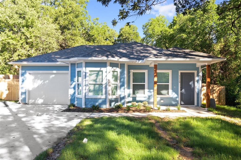 1119 East Epstein Street Sherman, TX 75090 - Photo 1 of 13 a front view of a house with a yard