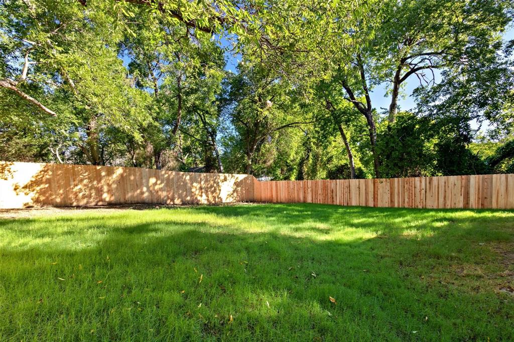 1119 East Epstein Street Sherman, TX 75090 - Photo 12 of 13 a view of a yard with wooden fence
