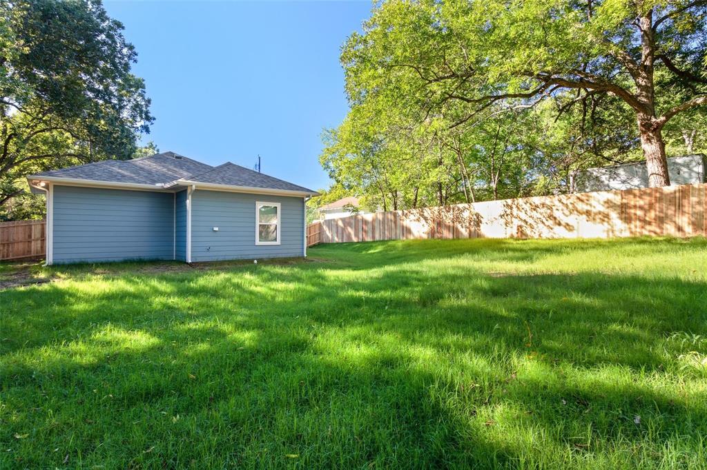 1119 East Epstein Street Sherman, TX 75090 - Photo 13 of 13 a view of a house with a yard