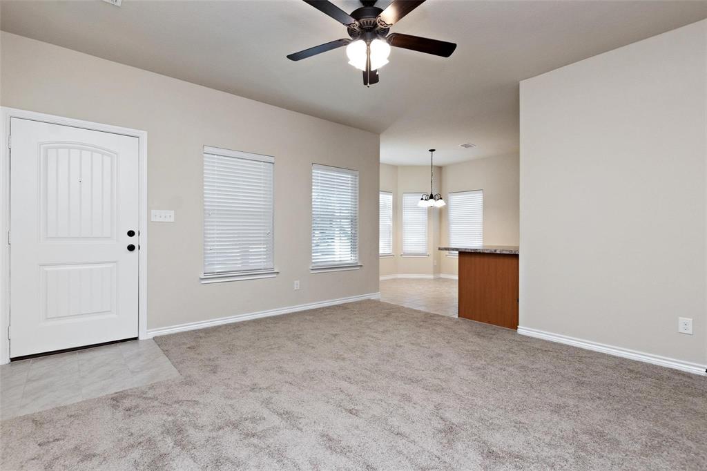 1119 East Epstein Street Sherman, TX 75090 - Photo 3 of 13 a view of an empty room with a window