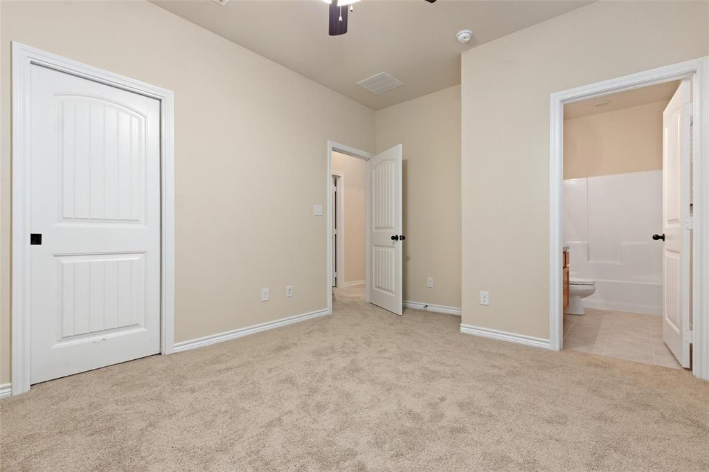 1119 East Epstein Street Sherman, TX 75090 - Photo 9 of 13 an empty room with closet and a bathroom