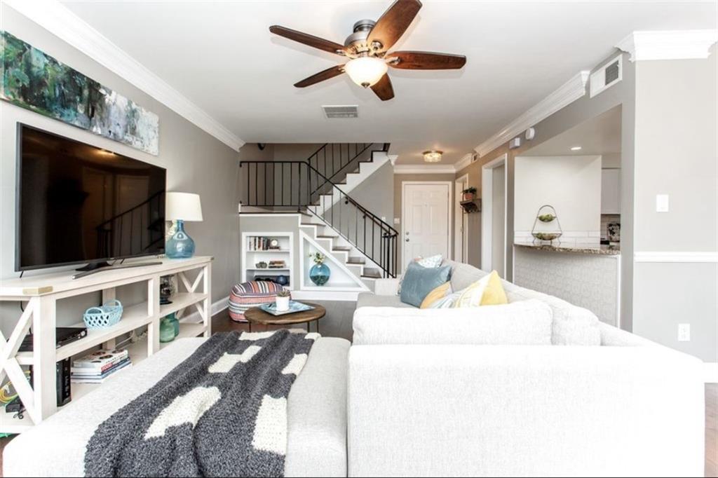 6980 Roswell Road, Unit B6 Atlanta, GA 30328 - Photo 2 of 31 a living room with furniture and a flat screen tv