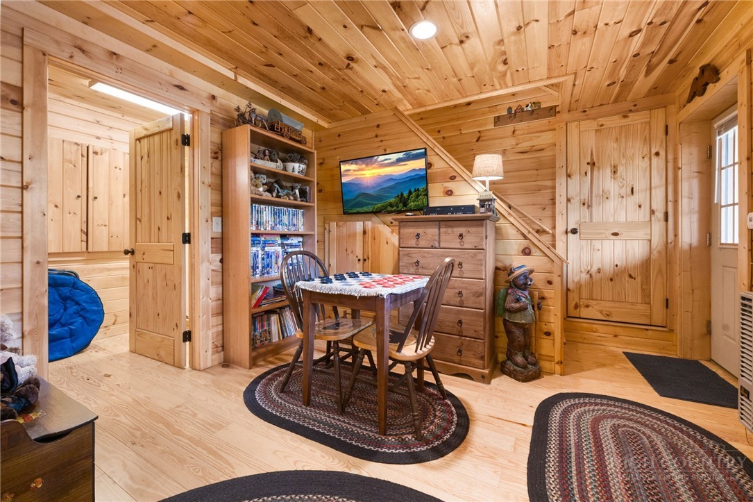 259 Greenbriar Road Beech Mountain, NC 28604 - Photo 25 of 41 a room with furniture and a chandelier