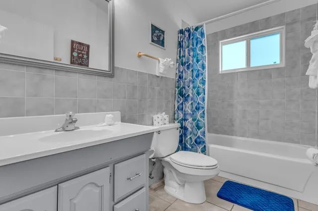 a bedroom with a bed and a lamp