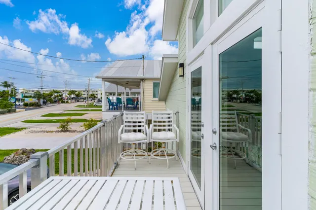 a view of a balcony with lake view and mountain view