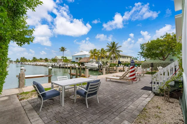 a view of a lake with boats and trees
