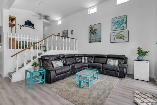 a view of a dining room with furniture and a window