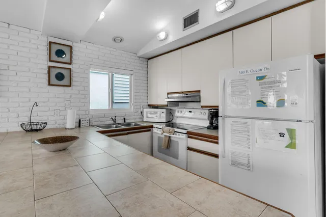 a bathroom with a sink a vanity and a mirror