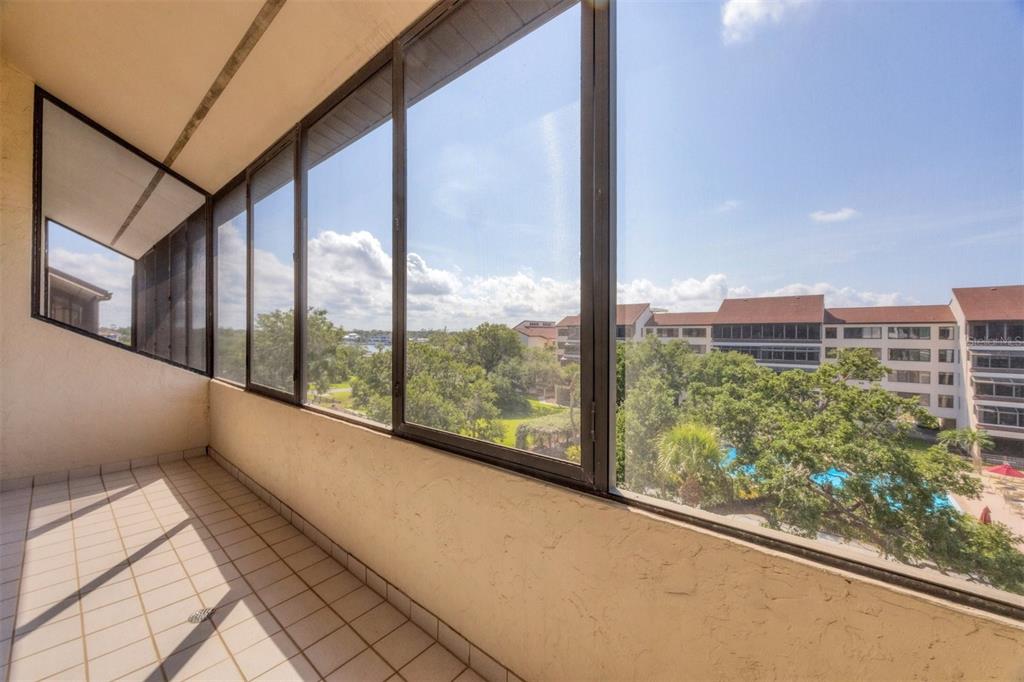 6285 Midnight Pass Road, Unit 403 Sarasota, FL 34242 - Photo 23 of 51 a view of a building from a window