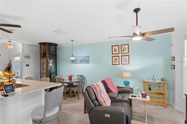 a bedroom with a bed a fireplace and a large window