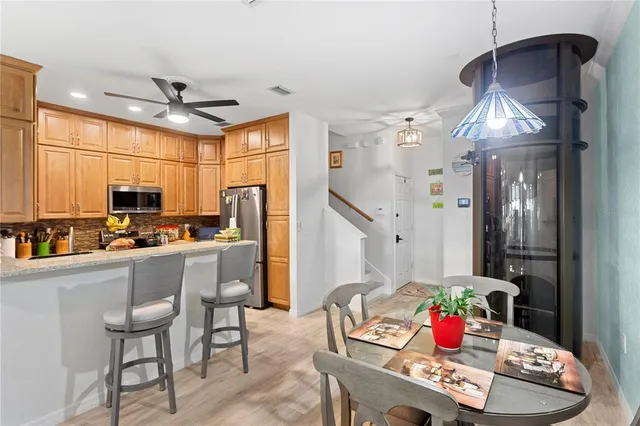 a bathroom with a granite countertop shower a sink and a mirror