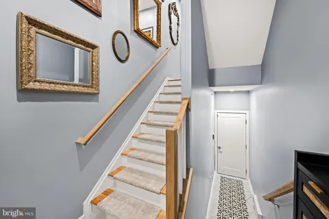 a view of an entryway with wooden floor