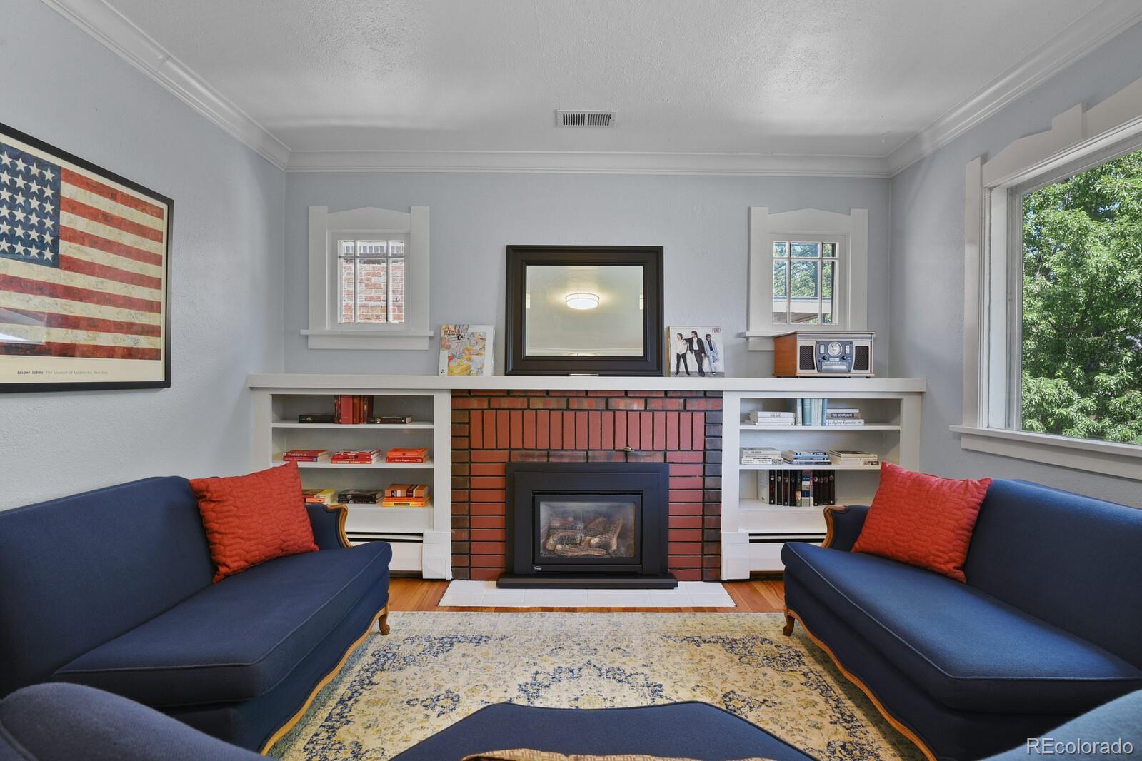 3615 Lowell Boulevard Denver, CO 80211 - Photo 2 of 23 a living room with furniture and a fireplace