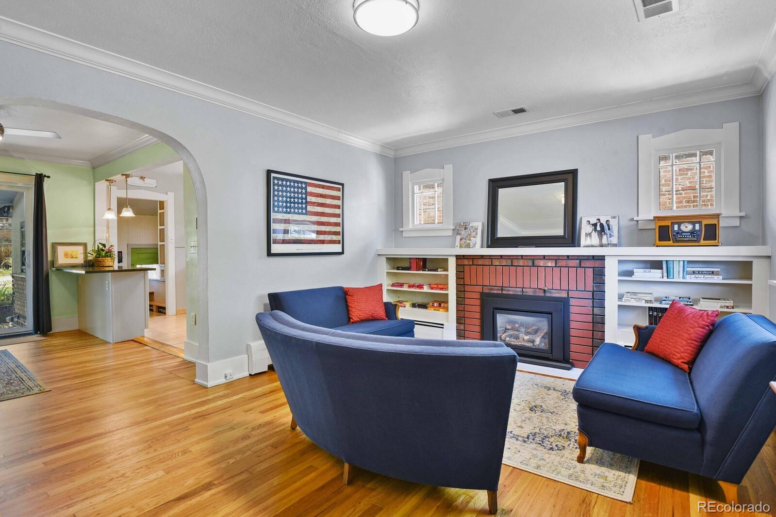 3615 Lowell Boulevard Denver, CO 80211 - Photo 3 of 23 a living room with furniture and a fireplace