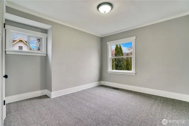 an empty room with windows