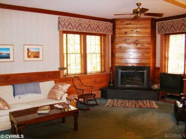 4515 Butte Road Richmond, VA 23235 - Photo 12 of 15 a living room with furniture a flat screen tv and a fireplace