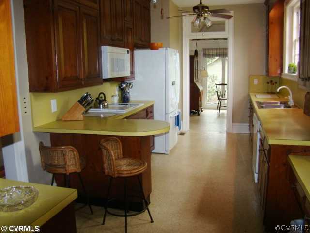 4515 Butte Road Richmond, VA 23235 - Photo 13 of 15 a view of a dining room with furniture and wooden floor