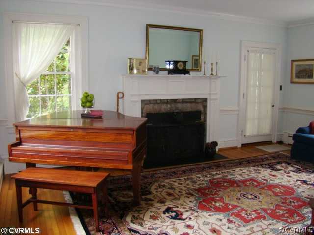 4515 Butte Road Richmond, VA 23235 - Photo 8 of 15 a living room with furniture and a fireplace