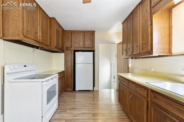 a view of a kitchen with electric appliances