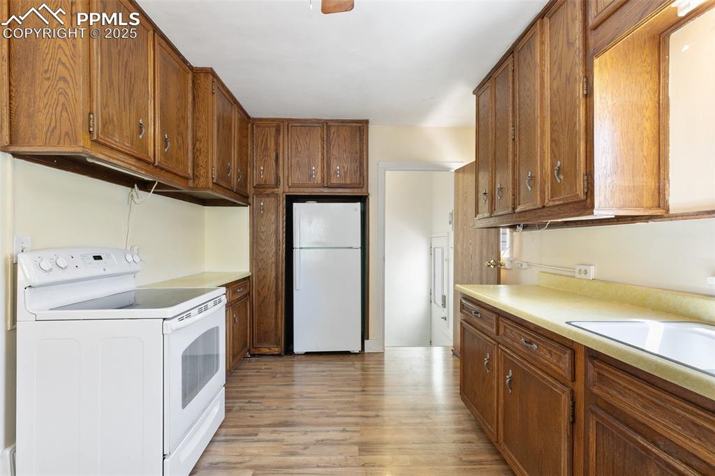 623 Swope Avenue Colorado Springs, CO 80909 - Photo 13 of 39 a view of a kitchen with electric appliances