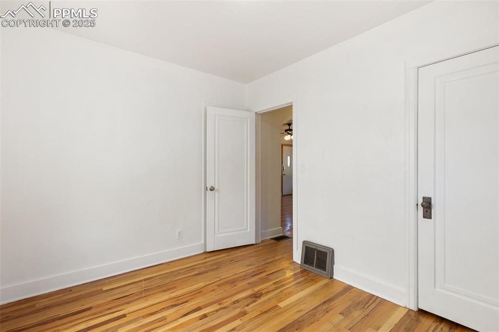 623 Swope Avenue Colorado Springs, CO 80909 - Photo 21 of 39 a view of a room with wooden floor