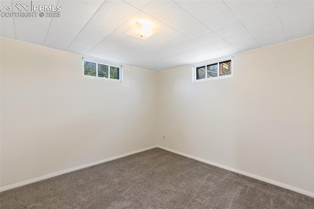 623 Swope Avenue Colorado Springs, CO 80909 - Photo 31 of 39 an empty room with windows