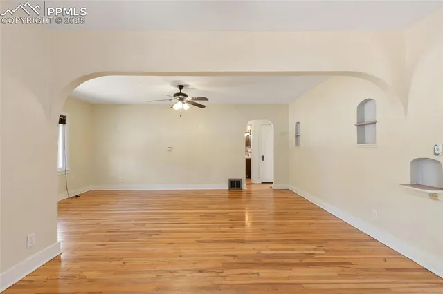 a view of an empty room with a window