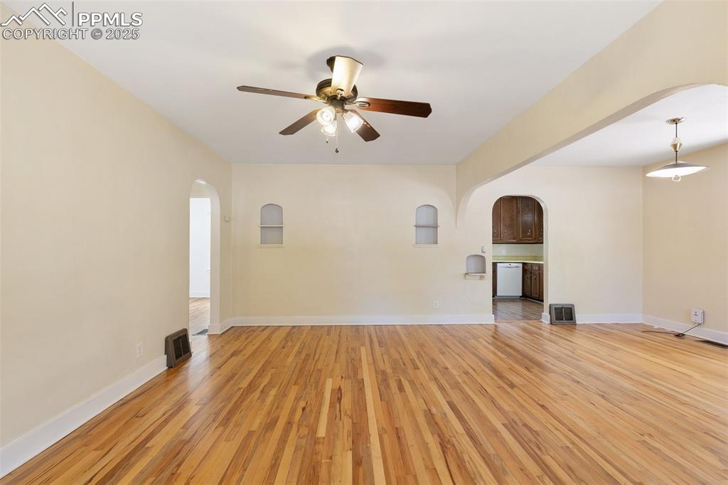 623 Swope Avenue Colorado Springs, CO 80909 - Photo 7 of 39 a view of empty room with wooden floor and fan