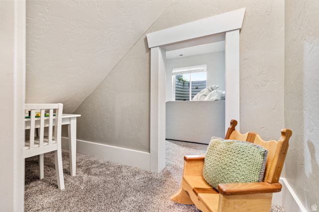 580 Cherry Ridge Lane Richmond, UT 84333 - Photo 40 of 53 Carpeted bedroom featuring a textured wall and vaulted ceiling