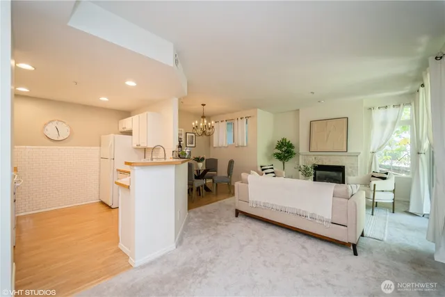 a living room with a couch and a fireplace