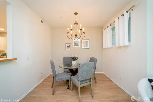 a view of a dining room with furniture and window