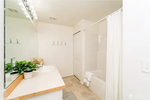 a bathroom with a shower curtain